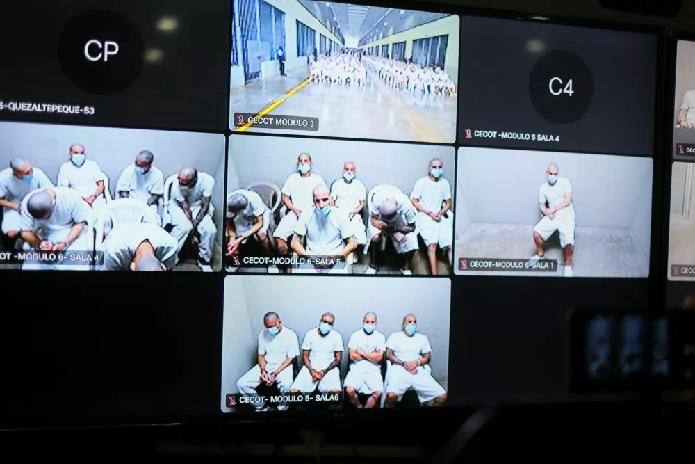 Members of Mara Salvatrucha, also known as MS-13 gang, are seen on a monitor as they attend an open hearing by El Salvador prosecutors against 486 members of the gang, who are accused of more than 47,000 crimes committed between 2012 and 2022, according to a statement from the Attorney General's Office, at the Judicial Center Against Organized Crime in Soyapango, El Salvador April 21, 2026. REUTERS/Jose Cabezas
