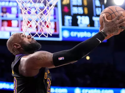 Los Angeles Lakers forward LeBron James shoots during the second half in Game 2 of a first-round NBA playoffs basketball series against the Houston Rockets, Tuesday, April 21, 2026, in Los Angeles. (AP Photo/Mark J. Terrill)