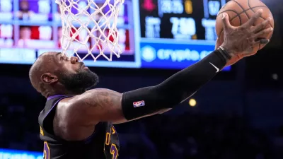 Los Angeles Lakers forward LeBron James shoots during the second half in Game 2 of a first-round NBA playoffs basketball series against the Houston Rockets, Tuesday, April 21, 2026, in Los Angeles. (AP Photo/Mark J. Terrill)
