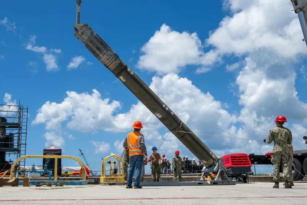NAVAL BASE GUAM (May 6, 2025) &ndash; Sailors assigned to Navy Munitions Command Pacific, East Asia Division, Unit Guam load UGM-109 Tomahawk missiles onto the Los Angeles-class fast-attack submarine USS Jefferson City (SSN 759), May 6, 2025. Assigned to Commander, Submarine Squadron 15 at Polaris Point, Naval Base Guam, Jefferson City is one of five fast-attack submarines forward-deployed in the Pacific. Renowned for their unparalleled speed, endurance, stealth, and mobility, fast-attack submarines serve as the backbone of the Navy's submarine force, ensuring readiness and agility in safeguarding maritime interests around the world. (U.S. Navy photo by Lt. James Caliva),Image: 1017624832, License: Rights-managed, Restrictions:, Model Release: no