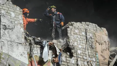 Rescuers works at a site of an apartment building hit by a Russian drone strike, amid Russia's attack on Ukraine, in Dnipro, Ukraine April 23, 2026. REUTERS/Stringer