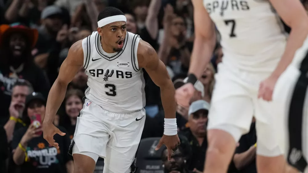 San Antonio Spurs forward Keldon Johnson (3) reacts after scoring against the Portland Trail Blazers during the first half in Game 2 of a first-round NBA playoffs basketball series in San Antonio, Tuesday, April 21, 2026. (AP Photo/Eric Gay)