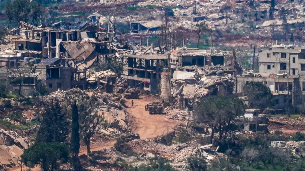 Israeli military vehicles and soldiers in a village in southern Lebanon as the Israeli army operates in it as seen from the Israeli side of the border, April 23, 2026 REUTERS/Ayal Margolin ISRAEL OUT. NO COMMERCIAL OR EDITORIAL SALES IN ISRAEL