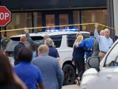Police and officials respond to a mass shooting at the Mall of Louisiana, Thursday, April 23, 2026, in Baton Rouge, La. (AP Photo/Matthew Hinton)