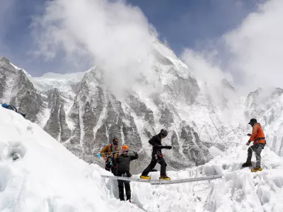 Mountaineers practice walking on a ladder during a training session at Everest base camp, Nepal April 15, 2025. REUTERS/Purnima Shrestha