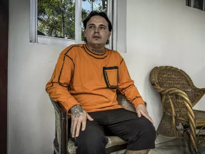 Hugo Palencia Ropero, 25, a Colombian national expelled from the United States, sits outside his room at a hotel in Kinshasa on April 22, 2026. They have been stranded for five days in a hotel on the outskirts of Kinshasa: expelled from the United States, fifteen migrants from Colombia, Ecuador, and Peru spent 27 hours on a plane, handcuffed and shackled, before finally landing in the Democratic Republic of Congo, several of these men and women told AFP on April 22, 2026.,Image: 1093553133, License: Rights-managed, Restrictions:, Model Release: no