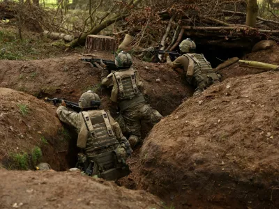 Ukrainian soldiers take part in a final tactical exercise on the fourth anniversary of Russia's full-scale invasion of Ukraine, held at a British Army training camp in East Anglia, Britain, February 24, 2026. REUTERS/Chris Radburn