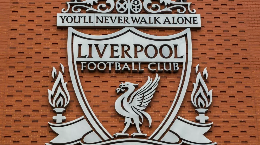 One of the two giant silver crests of Liverpool FC pictured on the new main stand. This crest has been used by the club since 1999 & features the Liver Bird, the Shankly Gates & two eternal flames to remember the victims of the Hillsborough disaster.,Image: 312909563, License: Royalty-free, Restrictions:, Model Release: no