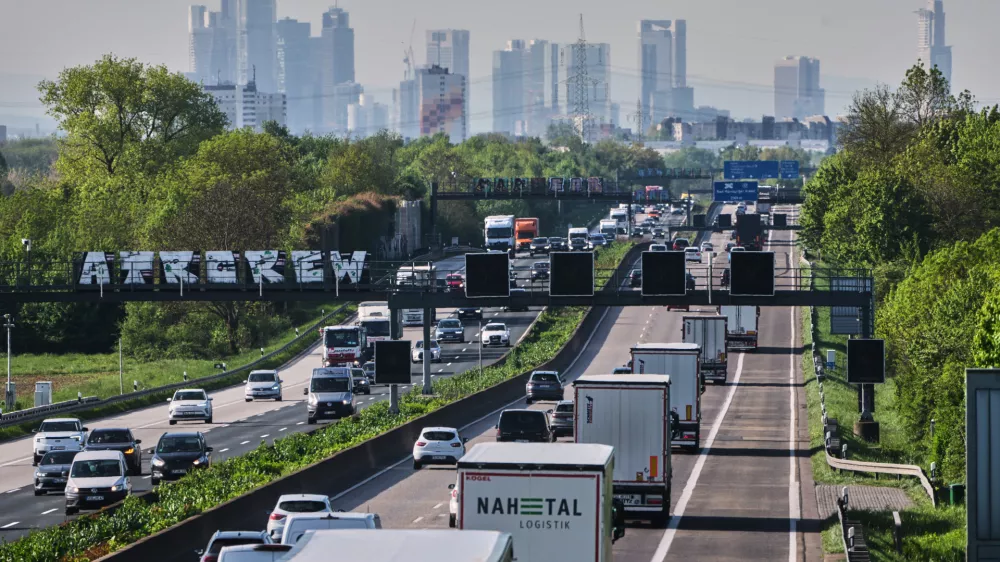 Cars and trucks move on a highway towards Frankfurt, Germany, Friday, April 24, 2026. (AP Photo/Michael Probst)