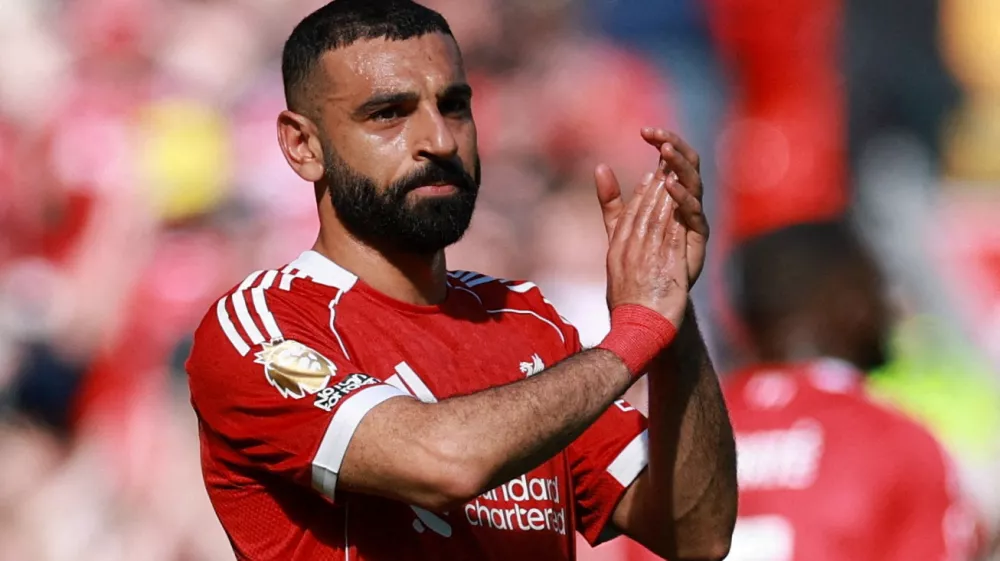 FILE PHOTO: Soccer Football - Premier League - Liverpool v Crystal Palace - Anfield, Liverpool, Britain - April 25, 2026 Liverpool's Mohamed Salah applauds fans as he walks off the pitch after being substituted REUTERS/Phil Noble EDITORIAL USE ONLY. NO USE WITH UNAUTHORIZED AUDIO, VIDEO, DATA, FIXTURE LISTS, CLUB/LEAGUE LOGOS OR 'LIVE' SERVICES. ONLINE IN-MATCH USE LIMITED TO 120 IMAGES, NO VIDEO EMULATION. NO USE IN BETTING, GAMES OR SINGLE CLUB/LEAGUE/PLAYER PUBLICATIONS. PLEASE CONTACT YOUR ACCOUNT REPRESENTATIVE FOR FURTHER DETAILS../File Photo