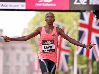 Sebastian Sawe from Kenya crosses the finish line to win the men's race at the London Marathon in London, Sunday, April 26, 2026.(AP Photo/Ian Walton)