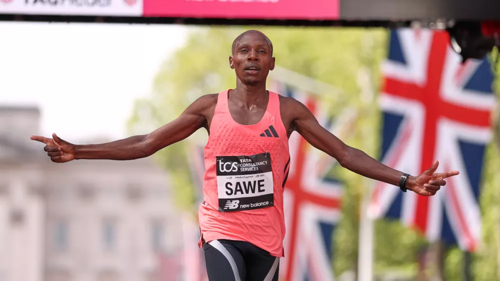 Sebastian Sawe from Kenya crosses the finish line to win the men's race at the London Marathon in London, Sunday, April 26, 2026.(AP Photo/Ian Walton)
