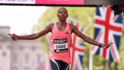 Sebastian Sawe from Kenya crosses the finish line to win the men's race at the London Marathon in London, Sunday, April 26, 2026.(AP Photo/Ian Walton)