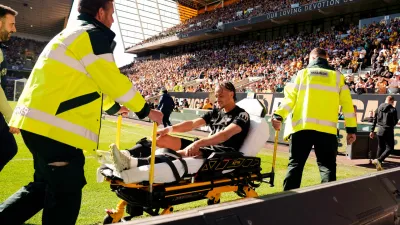 Tottenham Hotspur's Xavi Simons is stretchered off the pitch during the English Premier League soccer match between Wolverhampton Wanderers and Tottenham Hotspur in Wolverhampton, England, Saturday April 25, 2026. (Nick Potts/PA via AP)