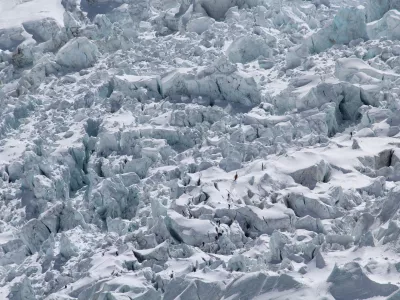 Apr 25, 2015 - Solo Khumba, Nepal - Climbers in the Khumbu Icefall. The scene after an avalanche triggered by a massive earthquake swept across Everest Base Camp, Nepal on Saturday April 25, 2015. Mountain guides and climbers stand beside camping and climbing gear gathered together after the avalanche hit, boots and camping gear lay strewn about at Everest Base Camp, Nepal. (Credit Image: ? P. Tu Sherpa/M. Bogati/ZUMA Wire)