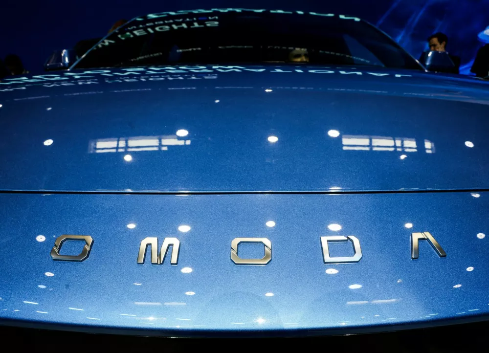 FILE PHOTO: A logo of Chery's brand Omoda appears on a car as people sit inside at the company's booth at the Beijing International Automotive Exhibition (Auto China), in Beijing, April 24, 2026. REUTERS/Maxim Shemetov/File Photo