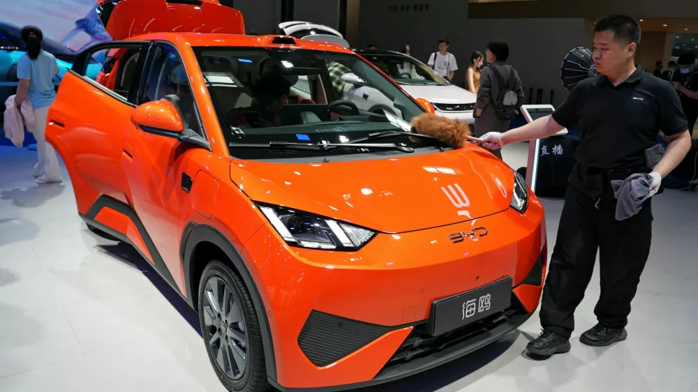 A staff member dusts a BYD Seagull electric vehicle (EV) displayed at the Beijing International Automotive Exhibition, or Auto China, in Beijing, China April 26, 2026. REUTERS/Xiaoyu Yin