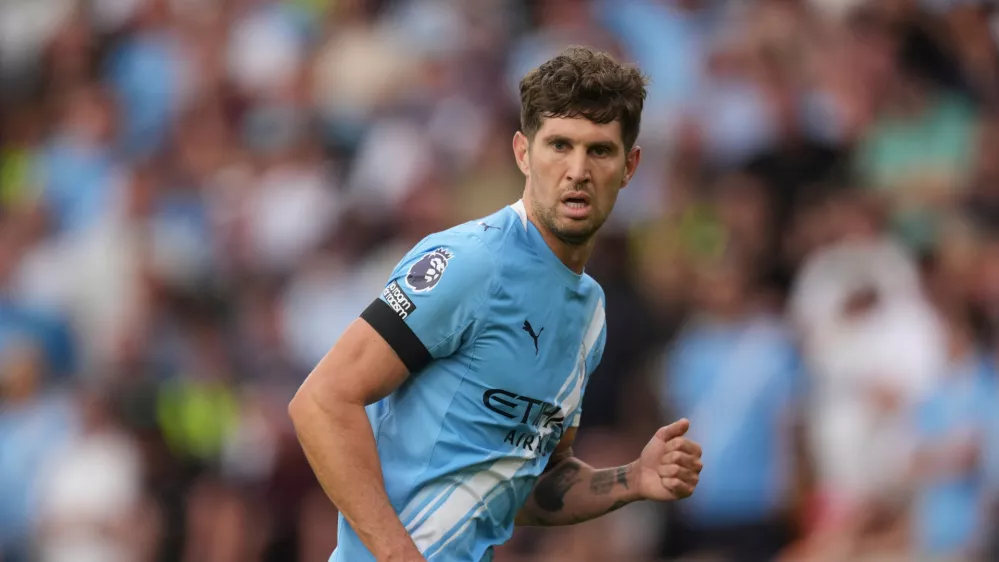 FILE - Manchester City's John Stones runs on the pitch during the English Premier League soccer match between Wolverhampton Wanderers and Manchester City at Molineux Stadium, Wolverhampton, England, Saturday, Aug. 16, 2025. (AP Photo/Dave Shopland, file)