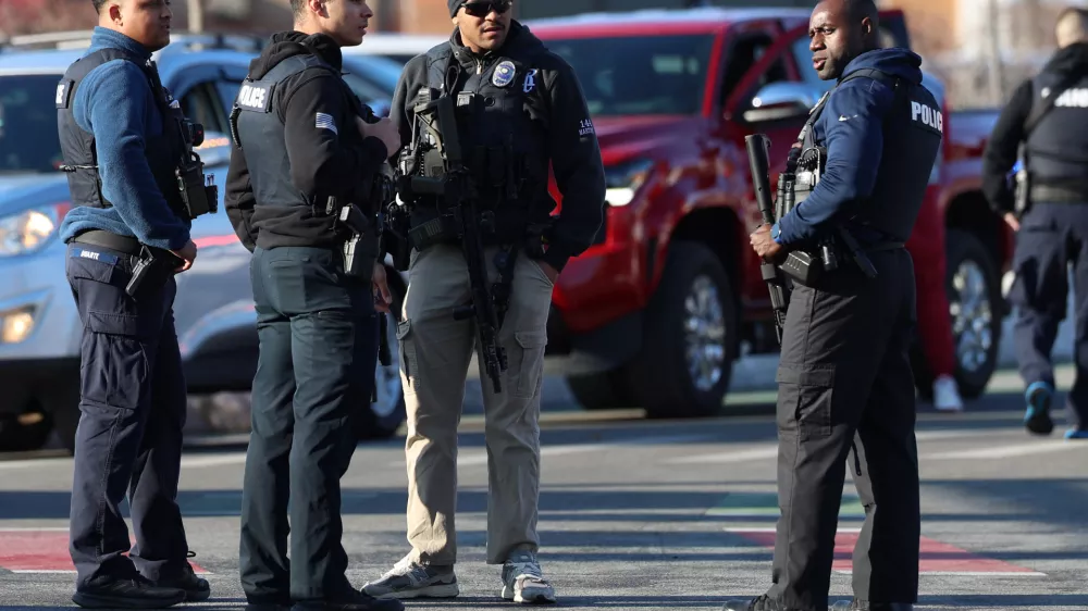 Police congregate near the Lynch Arena in Pawtucket, R.I., after a shooting occurred at the ice rink, Monday, Feb. 16, 2026. (AP Photo/Mark Stockwell)