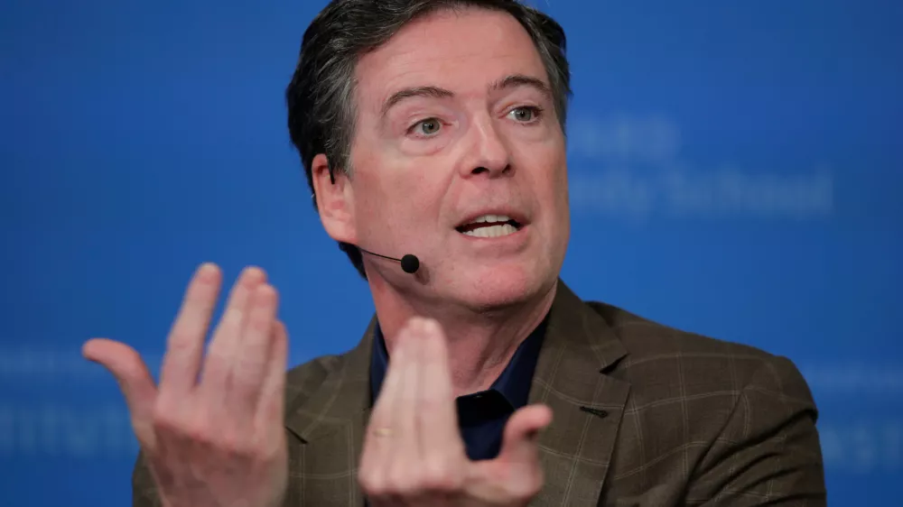 FILE - Former Director of the Federal Bureau of Investigation James Comey at Harvard University's Institute of Politics' JFK Jr. Forum in Cambridge, Mass., Feb. 24, 2020. (AP Photo/Charles Krupa, File)