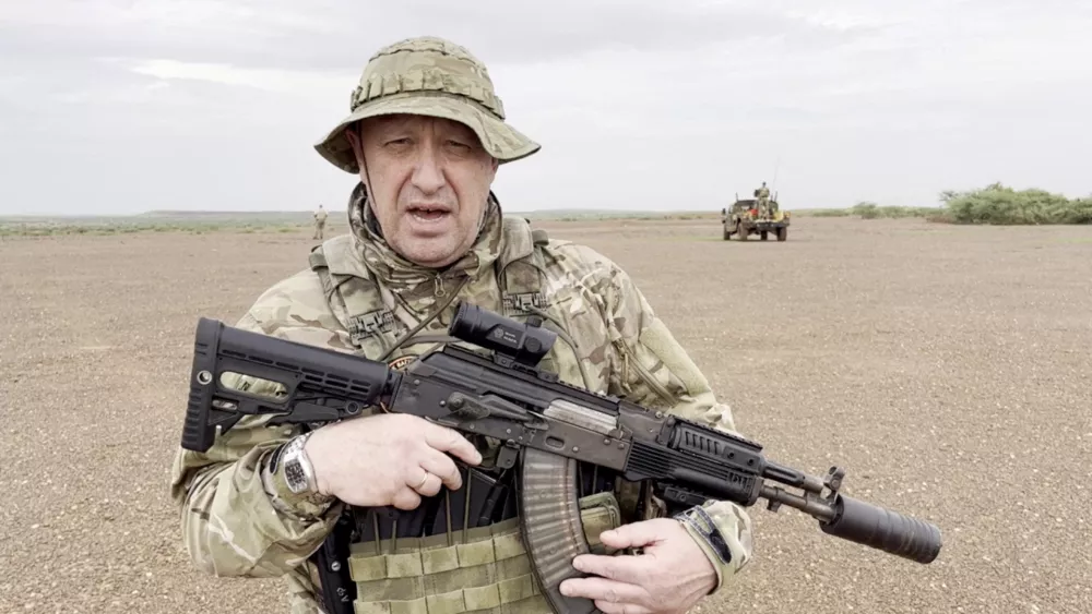 Yevgeny Prigozhin, chief of Russian private mercenary group Wagner, gives an address in camouflage and with a weapon in his hands in a desert area at an unknown location, in this still image taken from video possibly shot in Africa and published August 21, 2023. Courtesy PMC Wagner via Telegram via REUTERS ATTENTION EDITORS - THIS IMAGE WAS PROVIDED BY A THIRD PARTY. NO RESALES. NO ARCHIVES. MANDATORY CREDIT.   TPX IMAGES OF THE DAY