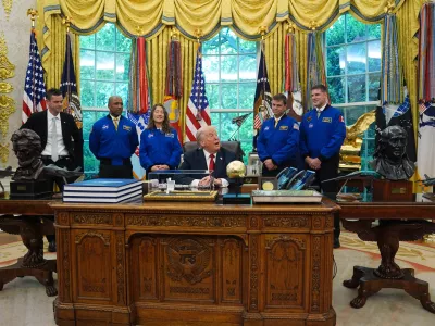 President Donald Trump speaks to reporters as he meets with NASA administrator Jared Isaacman, from left, and Artemis II astronauts Victor Glover, Christina Koch, Reid Wiseman and Jeremy Hansen in the Oval Office of the White House, Wednesday, April 29, 2026, in Washington. (AP Photo/Matt Rourke)