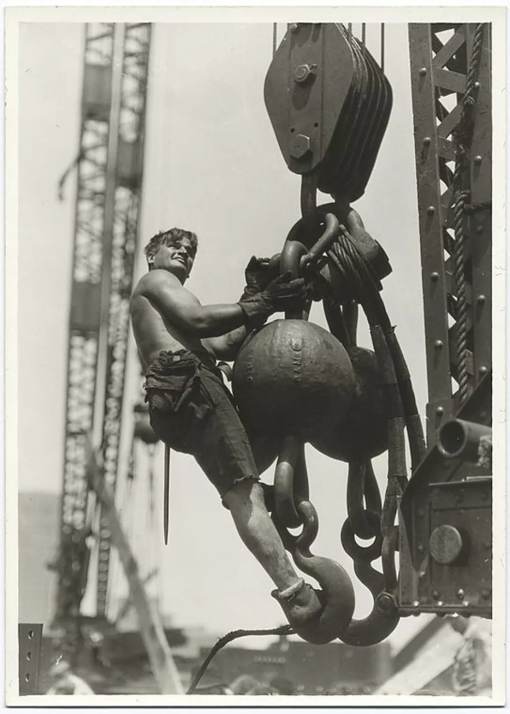 A SERIES OF INCREDIBLE images showing the construction of New York's Empire State Building in the 1930s have revealed the astonishing lengths workers would go to to complete what was then the tallest building in the world. Photos from 1930 show one man clinging to a steel beam hundreds of feet in the air with the city of New York in the background, with another showing a worker preparing to leap from one wooden board to another from a dangerous height. Further images show one worker hanging onto a single cable wire as he fits some wiring to run along it, with several other images showing men in a series of precarious positions as they carry out work on the 381-metre-high structure / Public Domain / mediadrumworld.com,Image: 363227742, License: Rights-managed, Restrictions:, Model Release: no