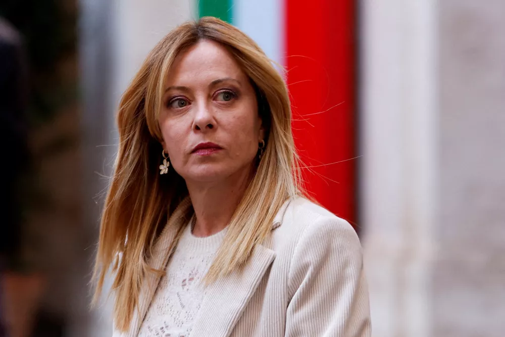 FILE PHOTO: FILE PHOTO: Italian Prime Minister Giorgia Meloni looks on as she waits for the arrival of President of Cyprus Nikos Christodoulides, at Chigi Palace, in Rome, Italy, February 26, 2026. REUTERS/Remo Casilli/File Photo