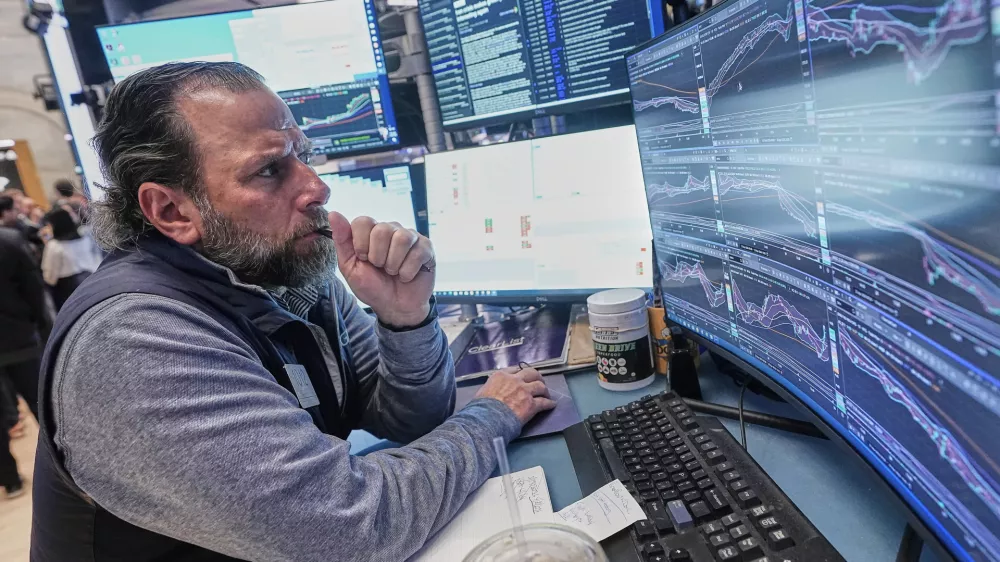 Specialist Michael Pistillo works at his post on the floor of the New York Stock Exchange, Thursday, April 30, 2026. (AP Photo/Richard Drew)
