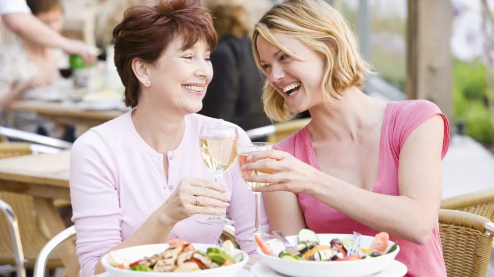 Mother and daughter at outdoor cafe