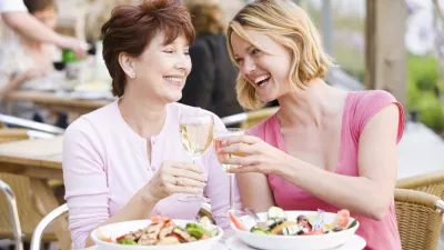 Mother and daughter at outdoor cafe