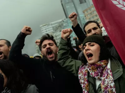 Union members shout slogans during scuffles with Turkish police as they try to march towards Taksim square in Istanbul, Turkey, Friday, May 1, 2026, during Labor Day celebrations. (AP Photo/Khalil Hamra)