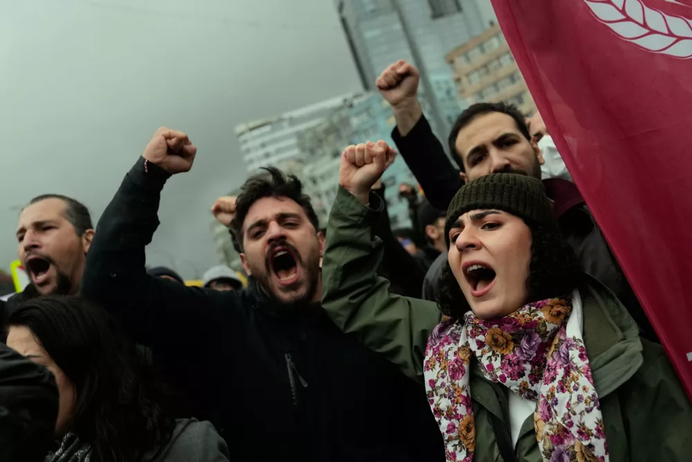 Union members shout slogans during scuffles with Turkish police as they try to march towards Taksim square in Istanbul, Turkey, Friday, May 1, 2026, during Labor Day celebrations. (AP Photo/Khalil Hamra)