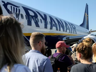 FILE PHOTO: Passengers board a Ryanair flight at the airport in Gdansk, Poland, June 19, 2019. REUTERS/Kevin Coombs/File Photo