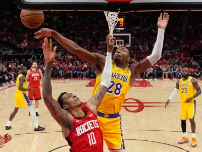 Los Angeles Lakers forward Rui Hachimura (28) blocks a shot by Houston Rockets forward Jabari Smith Jr. (10) during the first half of Game 6 of a first-round NBA playoffs basketball series in Houston, Friday, May 1, 2026. (AP Photo/Ashley Landis)