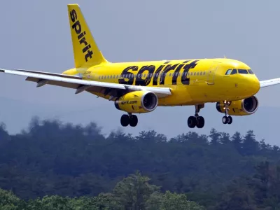 FILE - A Spirit Airlines 319 Airbus approaches Manchester Boston Regional Airport for a landing, June 2, 2023, in Manchester, N.H. (AP Photo/Charles Krupa, File)