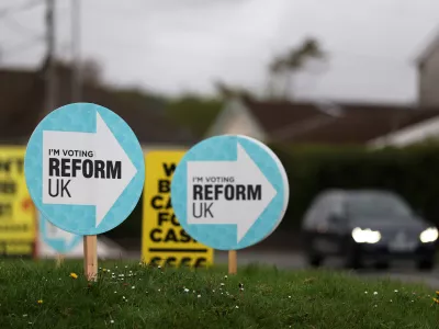 Signs supporting the Reform UK party are displayed outside a car dealership, ahead of the upcoming Senedd (Welsh Parliament) devolved general election, in Caerphilly, south Wales, Britain, April 16, 2026. REUTERS/Toby Melville