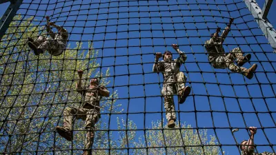 April 8, 2025 - Vicenza, Italy - U.S. Soldiers assigned to 4th Battalion, 319th Field Artillery Regiment, 173rd Airborne Brigade, climb an obstacle during U.S. Army Southern European Task Force, Africa (SETAF-AF) Best Squad Competition (BSC) at Caserma Del Din, Italy, April 8, 2025. The three-day SETAF-AF BSC assesses each squad on their technical and tactical proficiency, as well as their ability to work as a disciplined and cohesive team. The top squads will represent SETAF-AF in the U.S. Army Europe and Africa BSC (Credit Image: ? Christopher Sanchez/U.S. Army/ZUMA Press Wire)