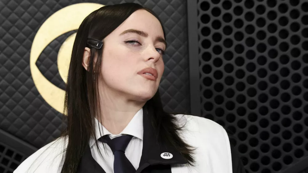 Billie Eilish wears ICE out pin as she poses at the red carpet during the 68th Annual Grammy Awards in Los Angeles, California, U.S., February 1, 2026. REUTERS/Mario Anzuoni
