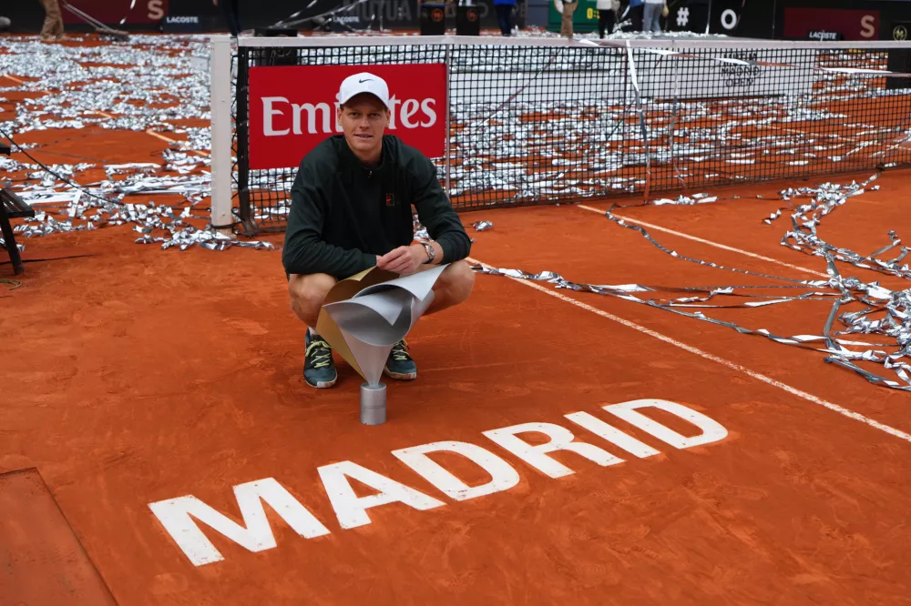 Jannik Sinner, of Italy, poses for photographers after winning the men's singles tennis final match against Alexander Zverev, of Germany, at the Madrid Open tennis tournament in Madrid, Spain, Sunday, May 3, 2026. (AP Photo/Manu Fernandez)