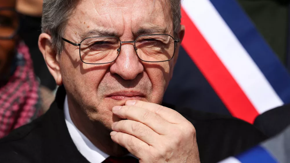 Jean-Luc Melenchon, leader of French far-left opposition party La France Insoumise (France Unbowed - LFI), listens to a speech during a rally against racism at the Mairie de Saint-Denis, called for by the newly elected mayor of Saint-Denis, Bally Bagayoko, in Saint Denis, Paris, April 4, 2026. REUTERS/Tom Nicholson
