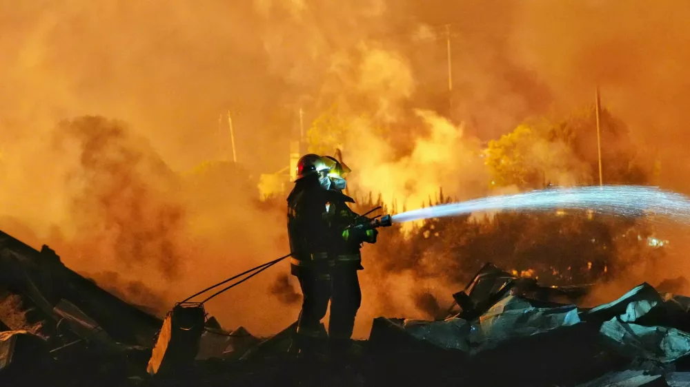 Firefighters work to extinguish a fire following a blast at a fireworks manufacturing factory in Liuyang, Hunan province, China, May 5, 2026. cnsphoto via REUTERS  ATTENTION EDITORS - THIS IMAGE WAS PROVIDED BY A THIRD PARTY. CHINA OUT.   TPX IMAGES OF THE DAY   REFILE - CORRECTING INFORMATION FROM "DISTINGUISH" TO "EXTINGUISH".