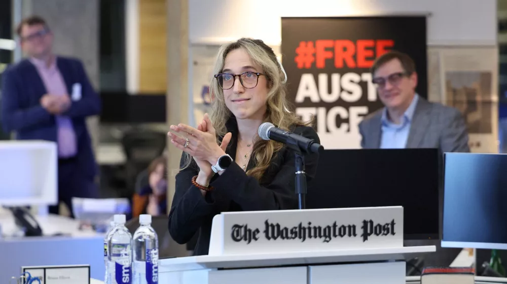Reporter and member of the winning team for the Pulitzer Prize for Public Service Hannah Natanson speaks to the newsroom after the announcement of the 2025 Pulitzer Prizes on May 4, 2026, in Washington D.C. The Washington Post was named the winner in Feature Photography and Public Service categories as well as a finalist in National Reporting.  Tom Brenner/Washington Post via REUTERS/Handout via REUTERS  THIS IMAGE HAS BEEN SUPPLIED BY A THIRD PARTY FOR USE ONLY WITH THE WASHINGTON POST 2026 PULITZER ANNOUNCEMENT. NO ARCHIVES. NO SALES.