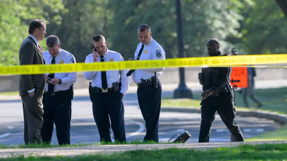 Metropolitan Police Department officers respond after a person was shot by law enforcement near the Washington Monument in Washington, Monday, May 4,, 2026. (AP Photo/Rod Lamkey Jr.)