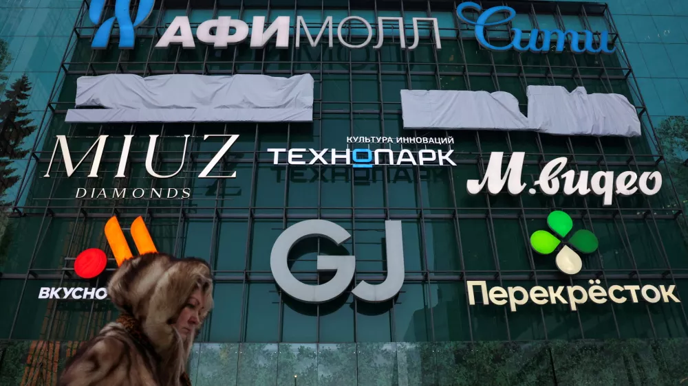 A woman walks past a shopping mall at the Moscow International Business Centre, also known as Moskva-City, in Moscow, Russia February 17, 2026. REUTERS/Ramil Sitdikov