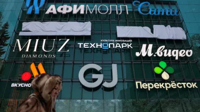 A woman walks past a shopping mall at the Moscow International Business Centre, also known as Moskva-City, in Moscow, Russia February 17, 2026. REUTERS/Ramil Sitdikov