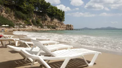 Alonissos - Lounge chairs on sandy beach