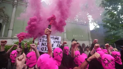 Pussy Riot and FEMEN activists stage a protest against Russia's presence after its absence following the 2022 invasion of Ukraine in front of the Russian pavilion, at the 2026 Art Venice Biennale, in Venice, Italy, Wednesday, May 6, 2026. (AP Photo/Luca Bruno)