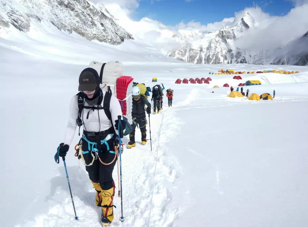 Members of an expedition team head to Camp 2 from Camp 1 during their rotation trip in the Solukhumbu district, also known as the Everest region, Nepal, May 4, 2026. REUTERS/Purnima Shrestht