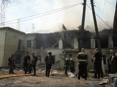 Rescuers work at the site of the kindergarten hit by a Russian drone strike, amid Russia's attack on Ukraine, in Sumy, Ukraine May 6, 2026. REUTERS/Stringer